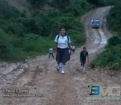 Kids in far southern Belize, where there are massive amounts of rain, trudge miles through the wet routes to school.